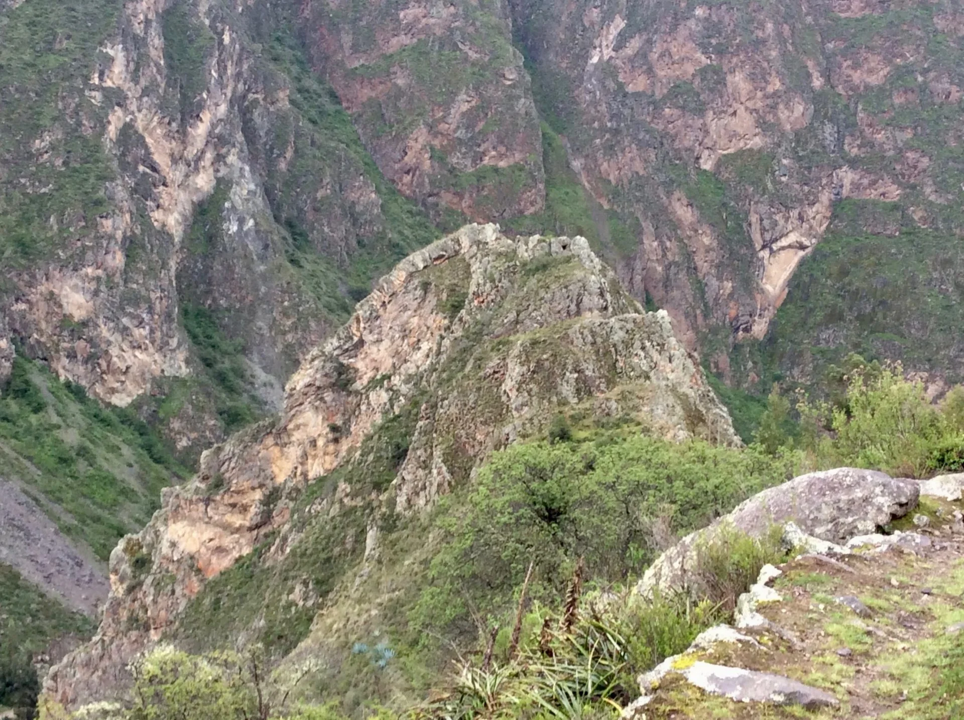 a face in the mountain on the way back from pumamarka in peru
