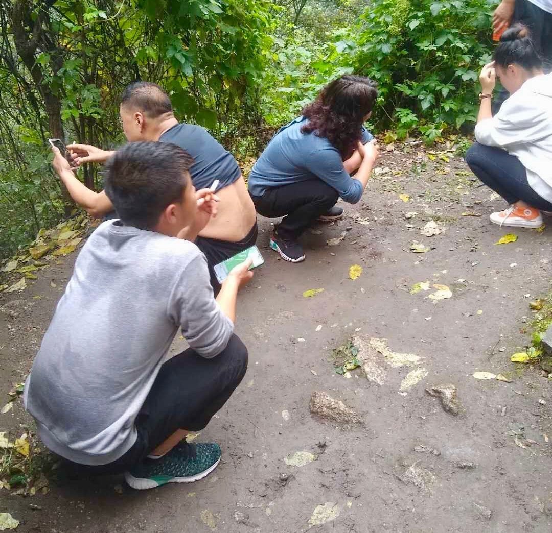 The squat-sit in China while on a hike