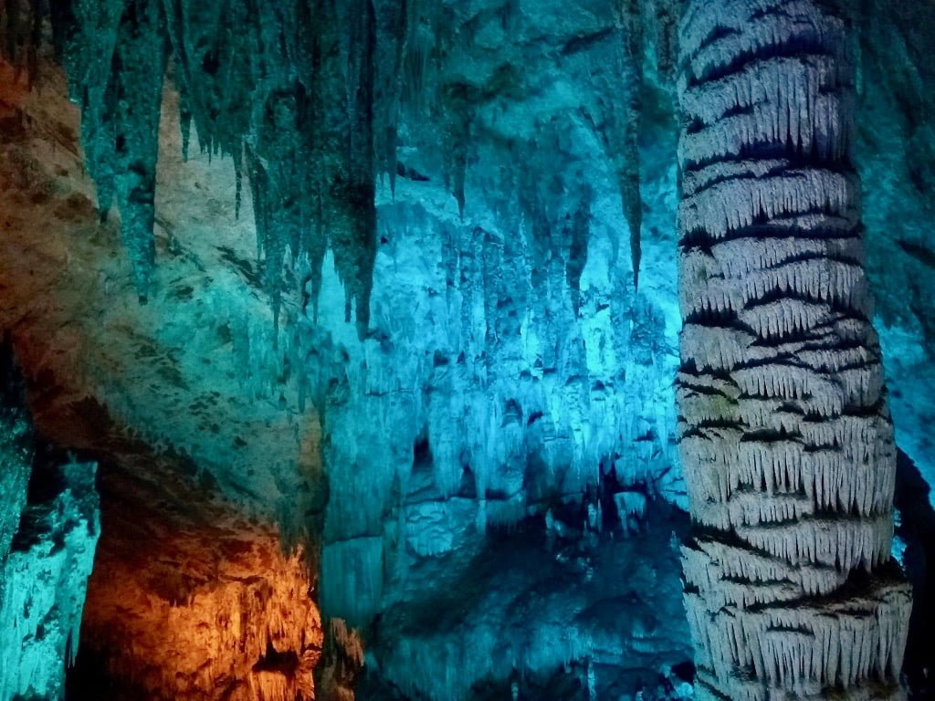 Furong Cave, lit up in blue and orange lights, a top thing to do in Wulong, China.
