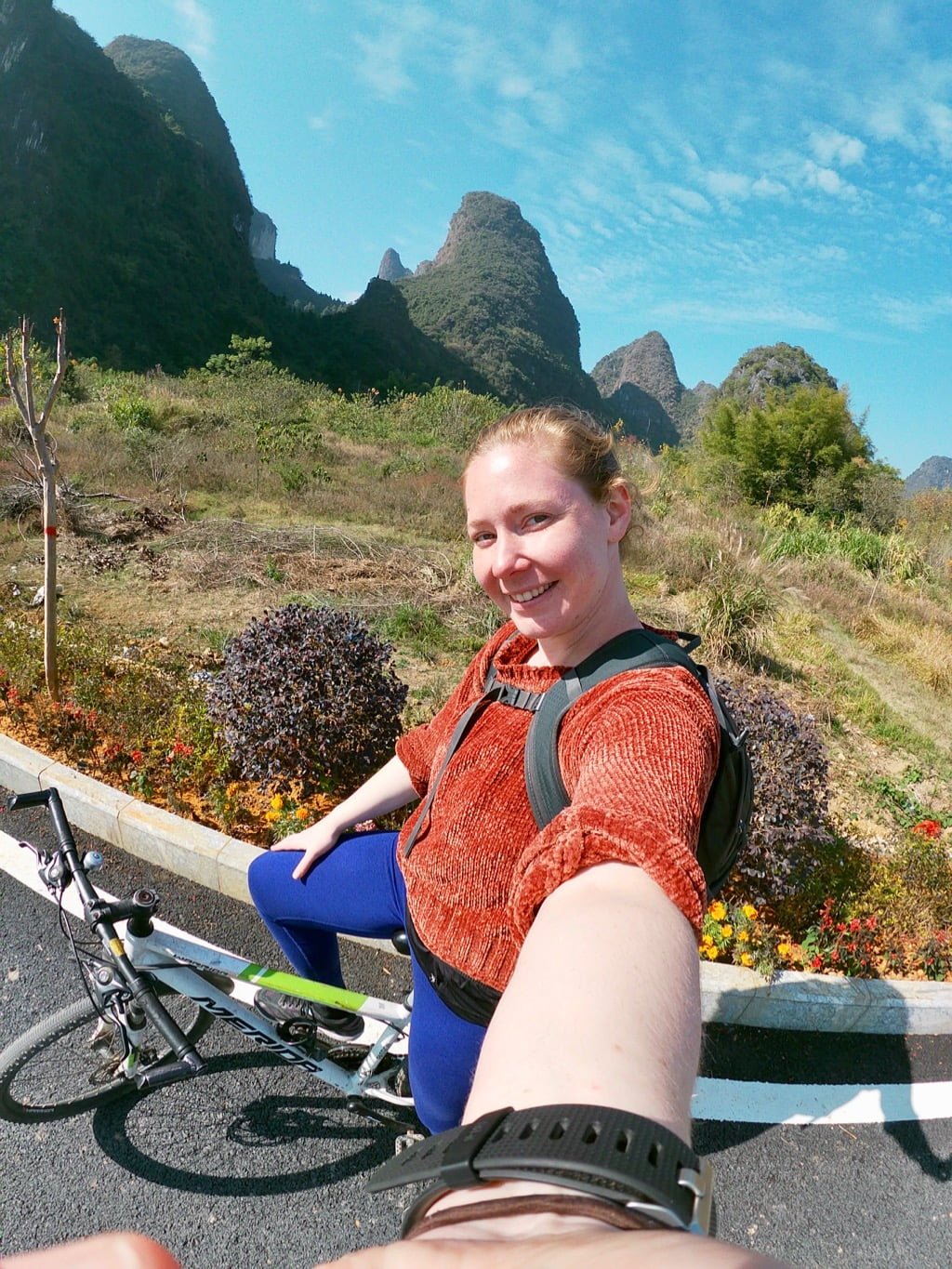 Riding a bike and taking a selfie in the countryside of Yangshuo