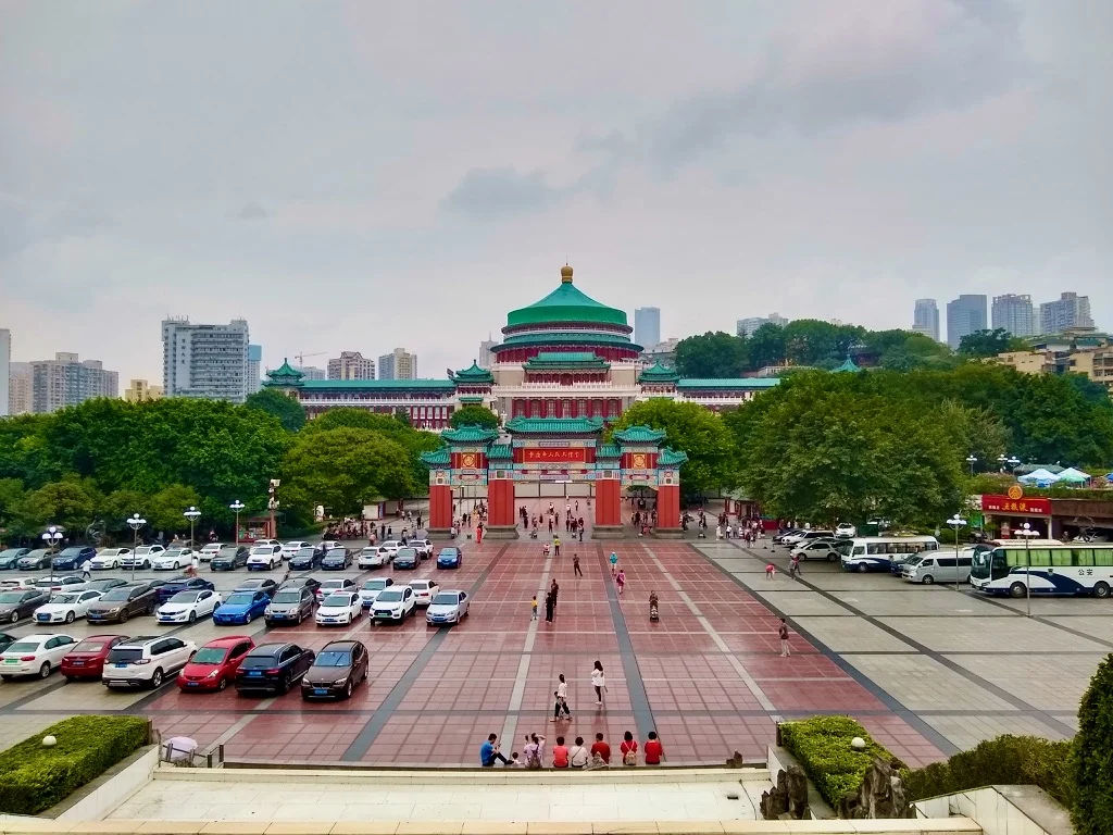 The Chongqing Three People's Hall, built in traditional Chinese architecture with a domed toof and a large square