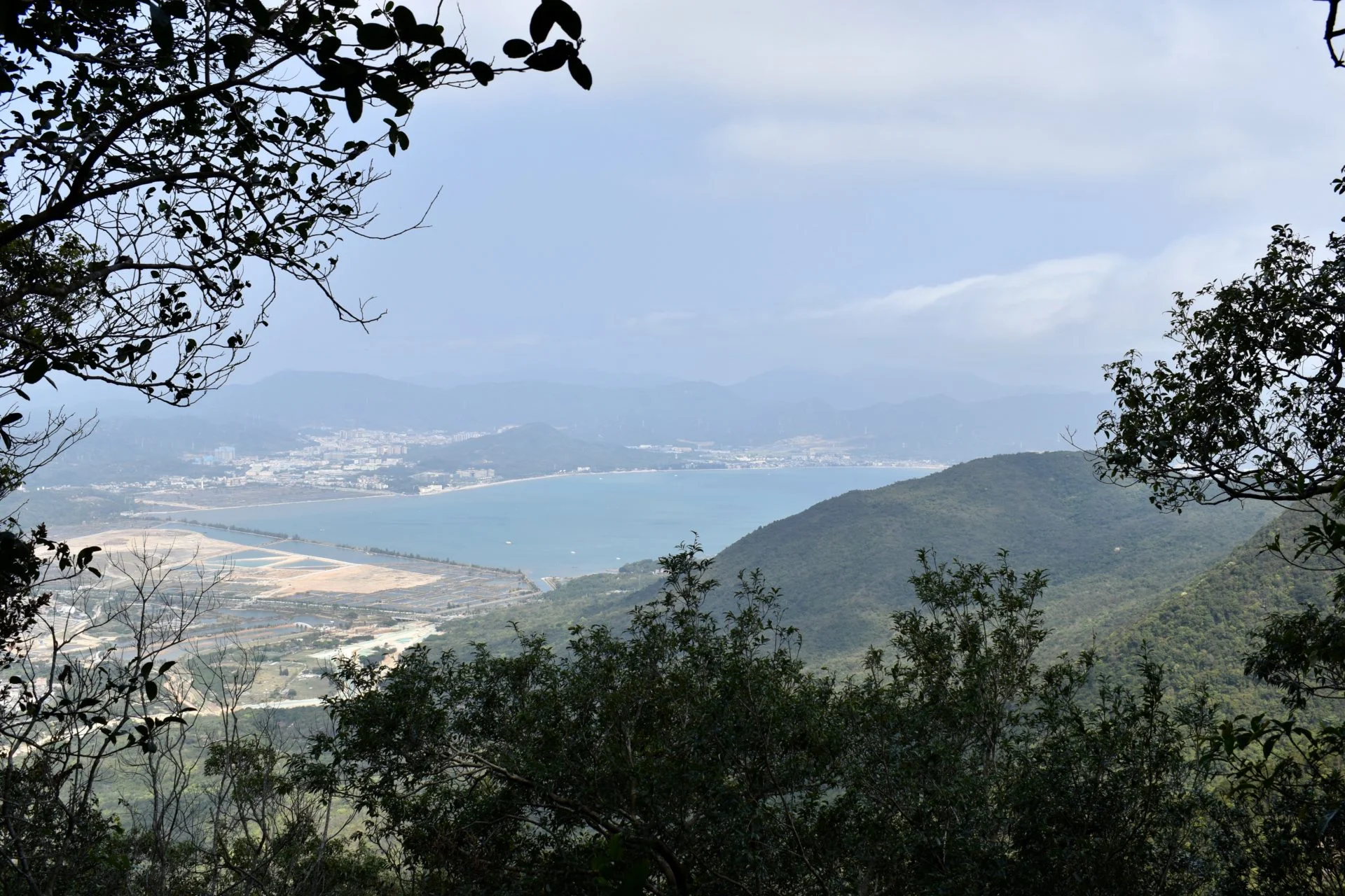 A picture of mountains, high up, then the sea connecting with the land: Qishan, Dapeng, Shenzhen, China